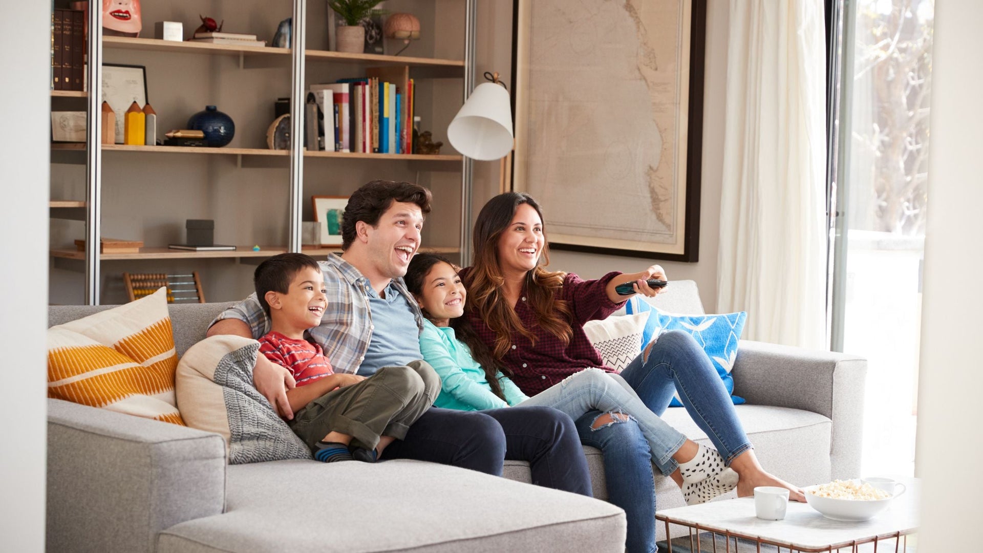 family is watching tv together