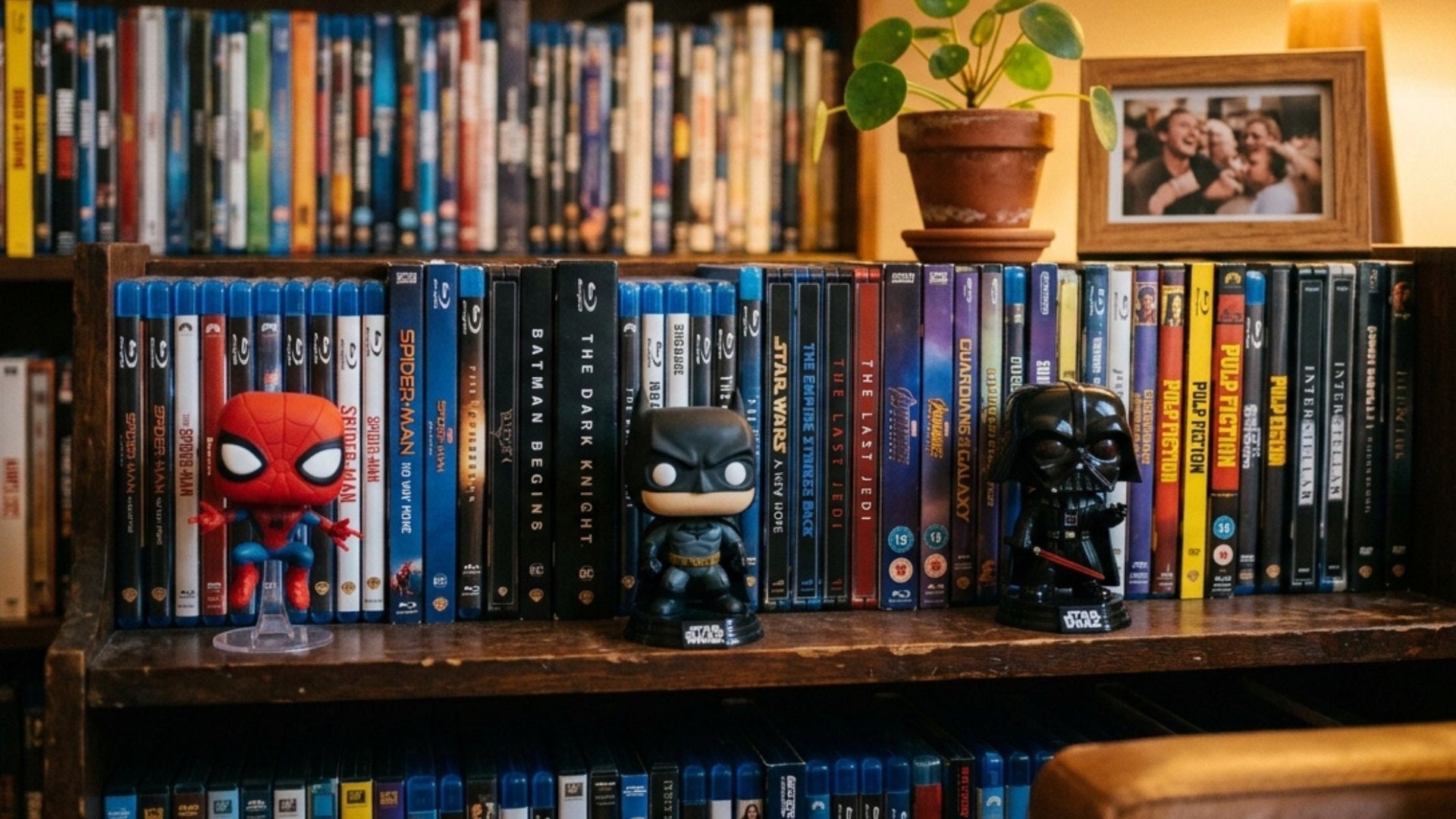 Best gifts for movie lovers — Blu-ray box sets, Funko Pops, and collectibles arranged on a wooden surface